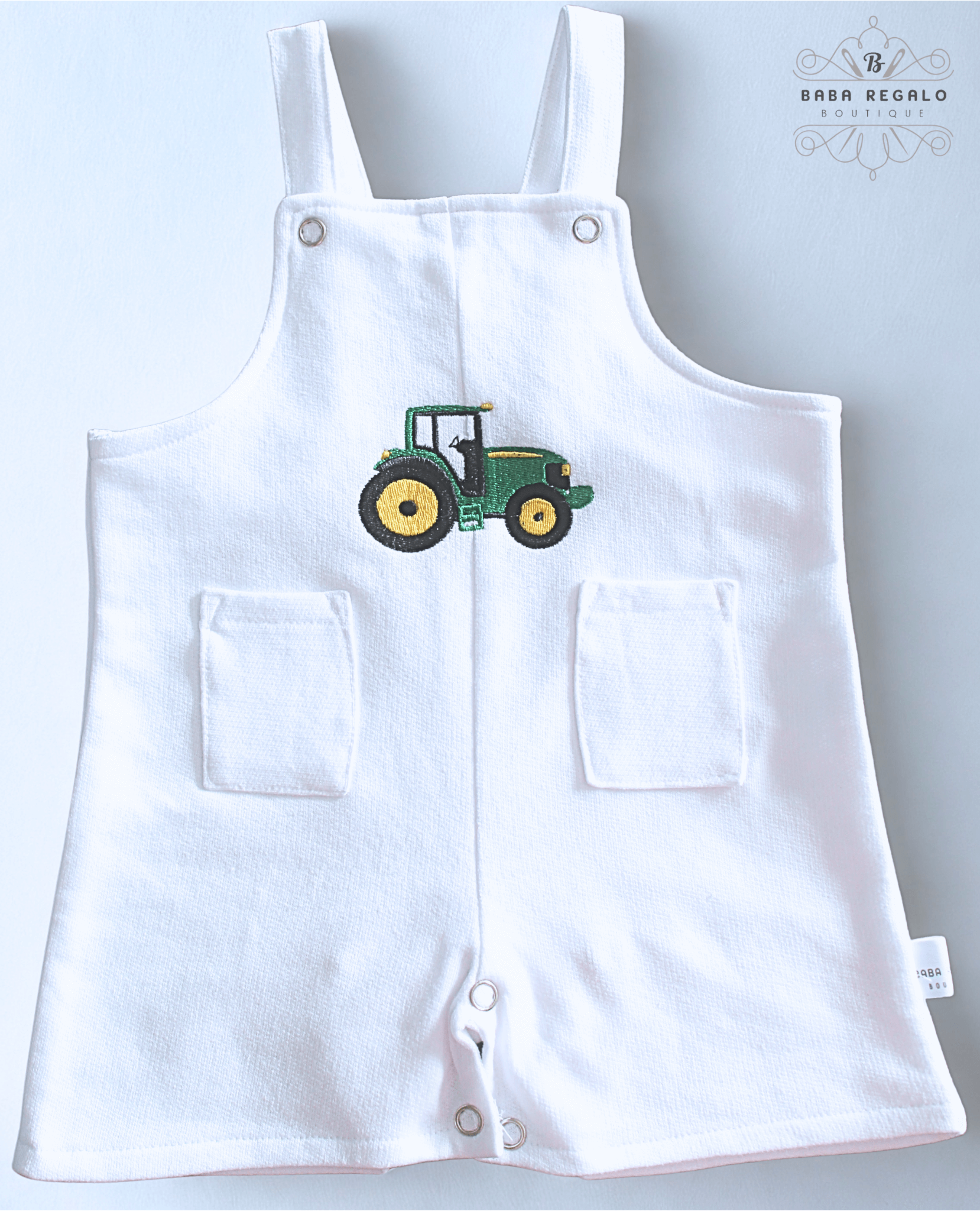 Adorable white cotton baby romper with tractor