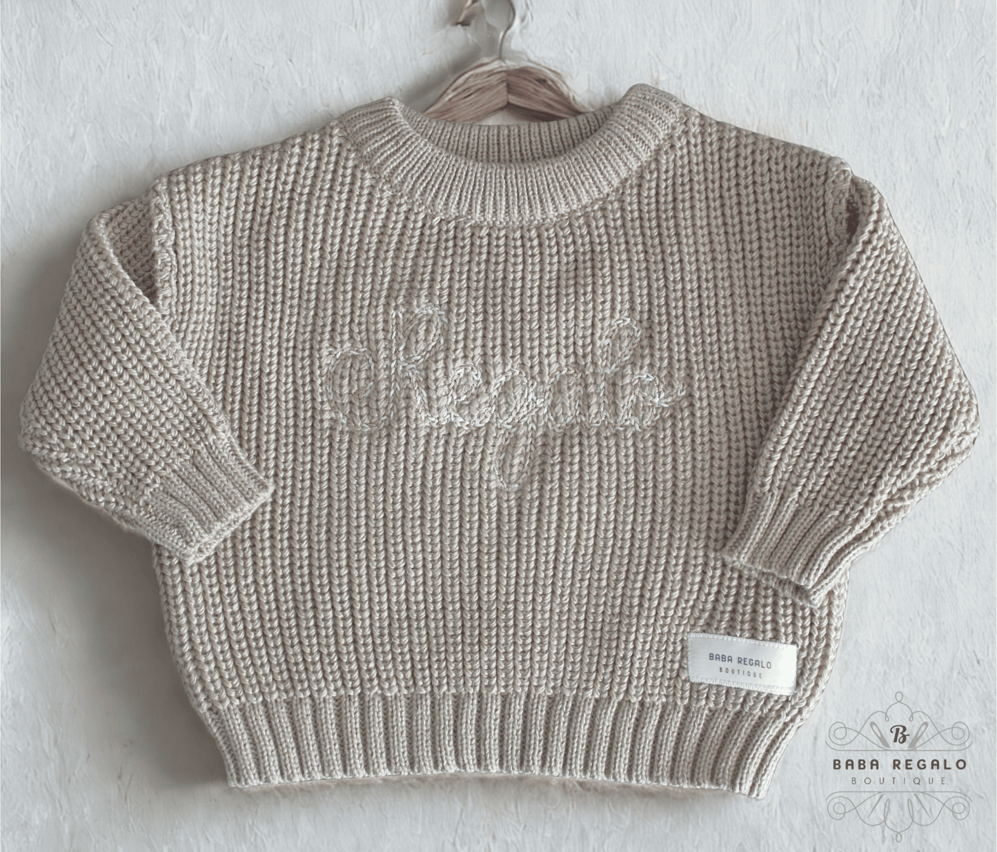Knitted ribbed sweater with embroidery