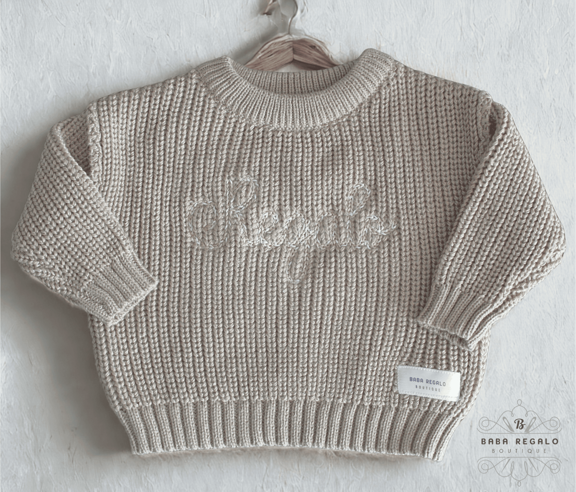 Knitted ribbed sweater with embroidery
