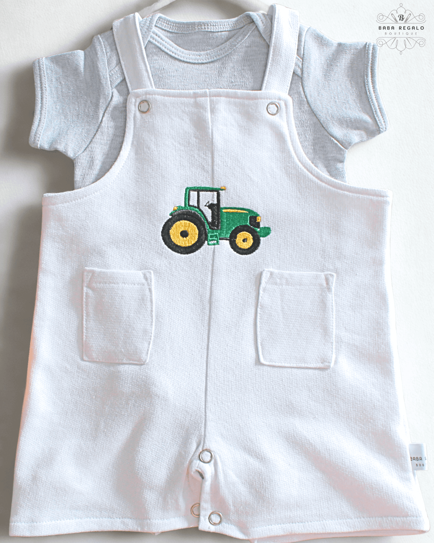 Adorable white cotton baby romper with tractor