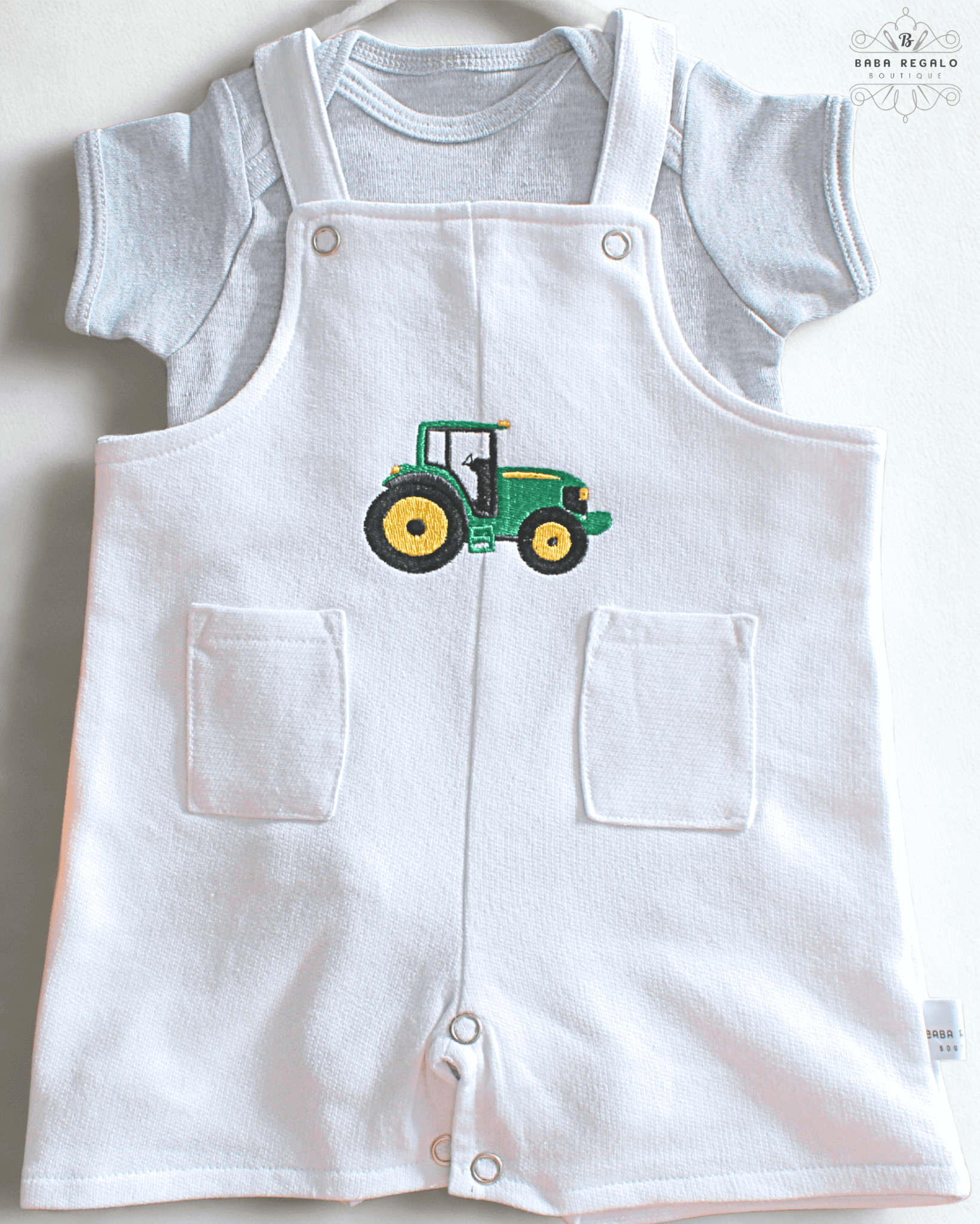 Adorable white cotton baby romper with tractor